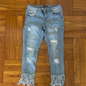 Distressed FashionNova Light Blue Jeans with Fringe Hem